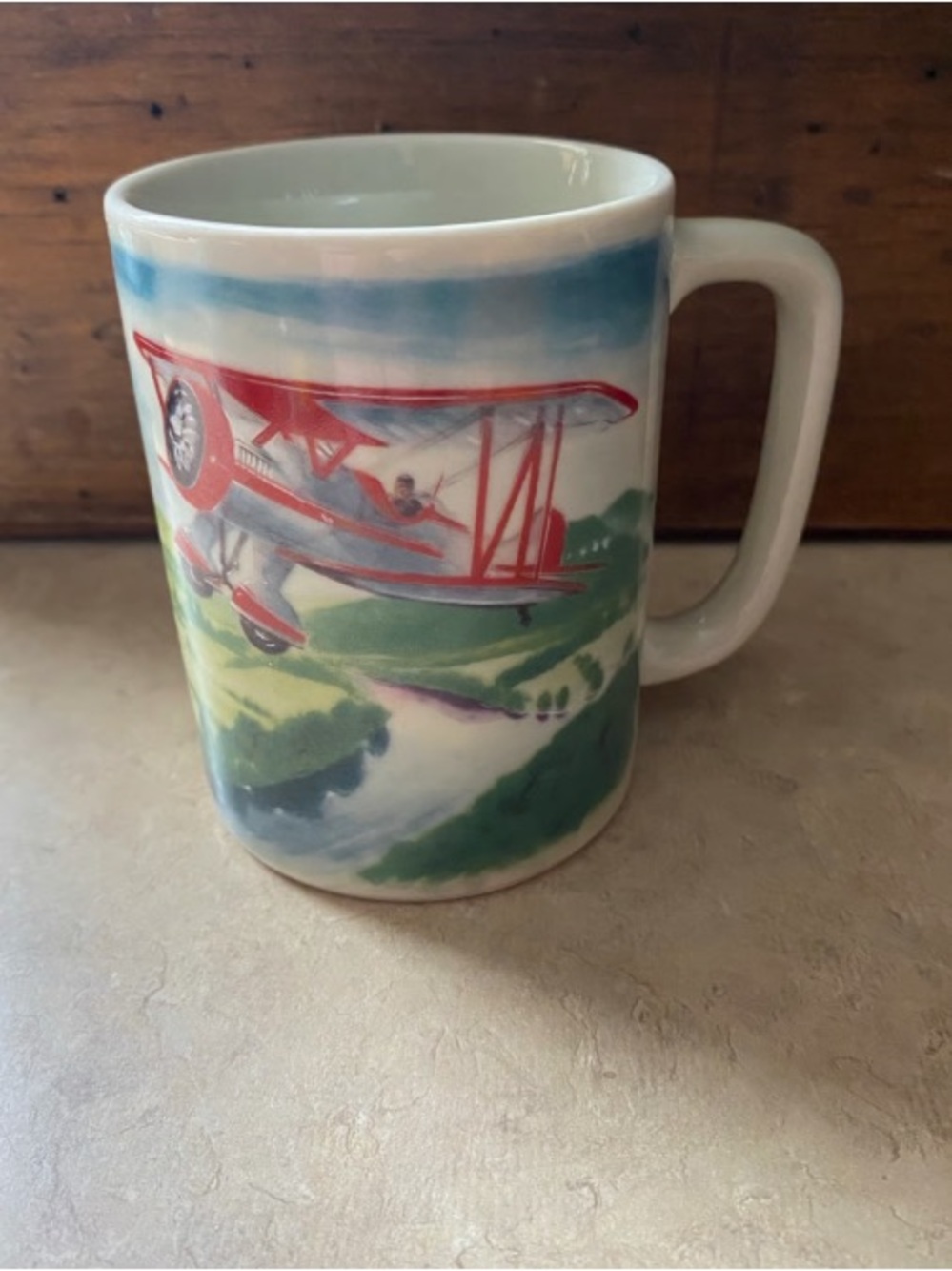 White Ceramic Mug with Red Biplane Illustration